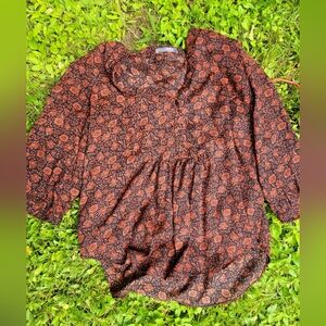 Orange and black floral blouse